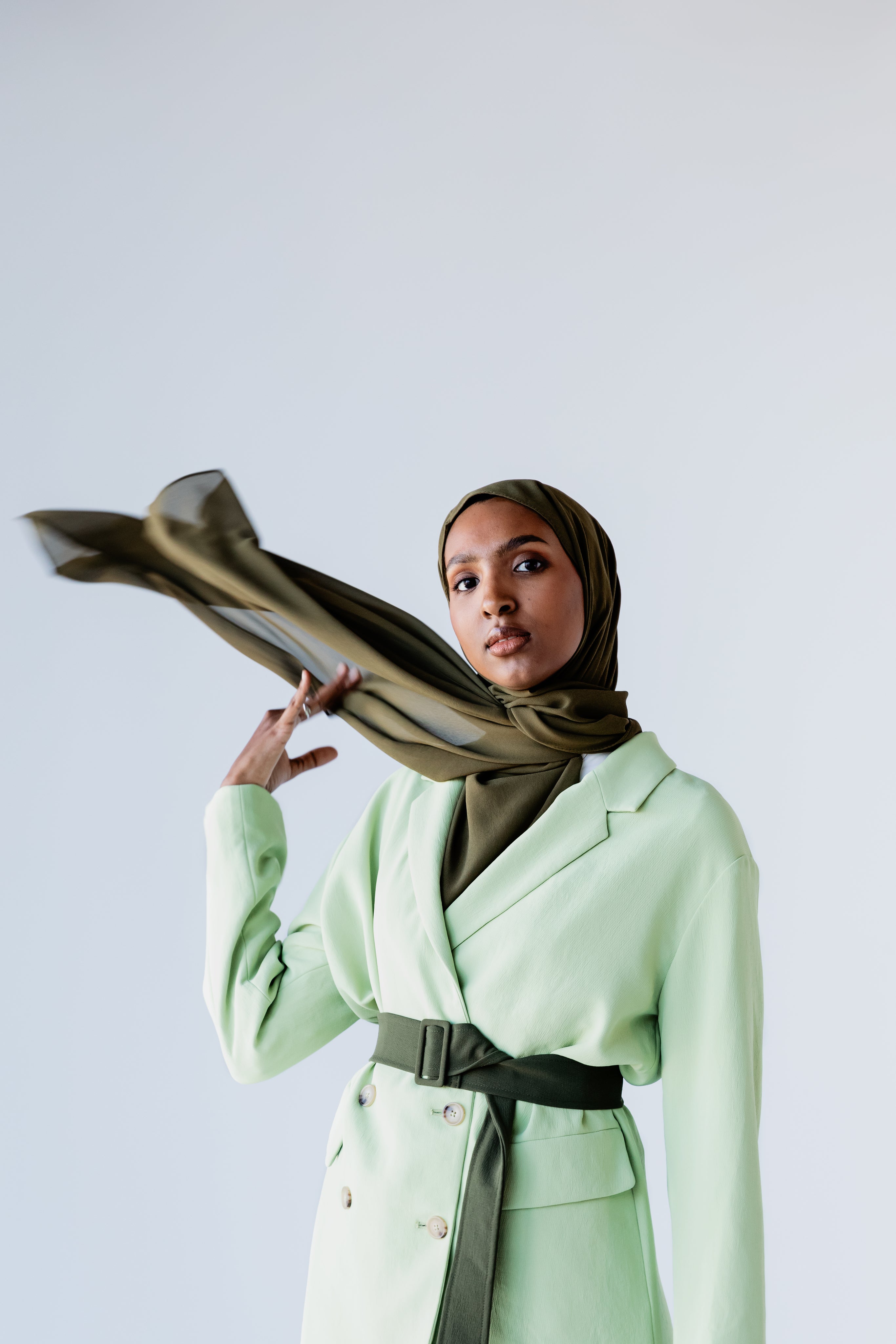 women with green silk scarf